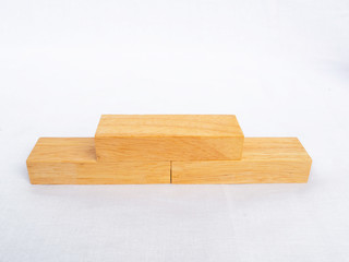Three wooden block pile on white background