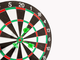 Obraz premium Target with three green dart focus on bull's eye, Setting challenging business goals And ready to achieve the goal with teamwork concept