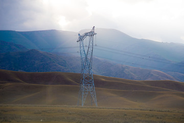 Electric pole on the mountain valley near Balykchy in Kyrgyzstan
