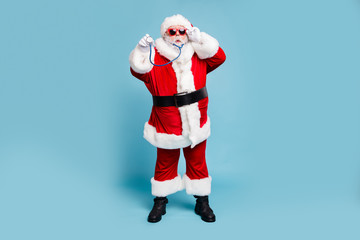 Full length body size view of his he nice funky bearded Santa Claus wearing phonendoscope making diagnostic isolated over blue turquoise pastel color background