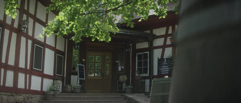 front entry of an old german timbering hotel in nature - Eingang eines deutschen Fachwerk Hotels in der Natur