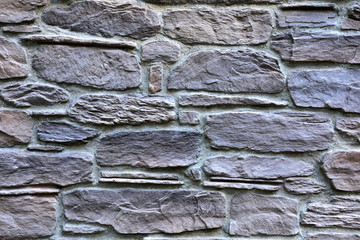 Old gray stone wall. Close-up. Texture.