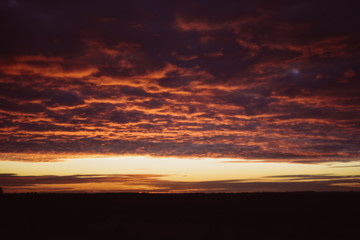 Dawn, field, colorful clouds, rising sun