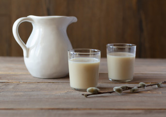 Oat milk in glasses. Alternative dairy-free vegan-friendly plant milk