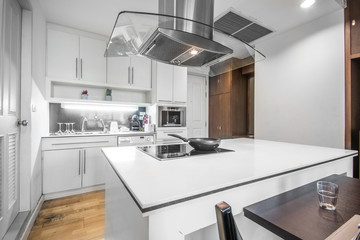 Clean white Luxurious Kitchens Counter and Cooking Equipment in the Apartment