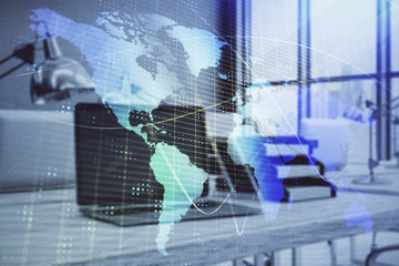 Map hologram and desktop office computer background. Multi exposure. Concept of international business