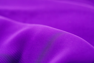 texture of the satin fabric of lilac color for the background.