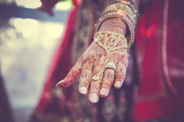 Indian hindu bride's wearing her wedding jewellery close up