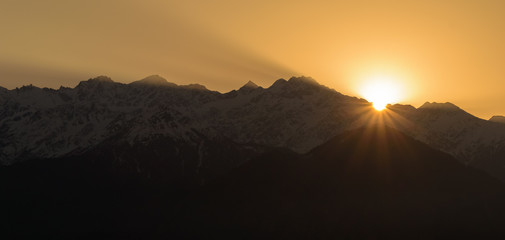 Sun rises behind the Panchachuli mountains in the Himalayan town of Munsyari.