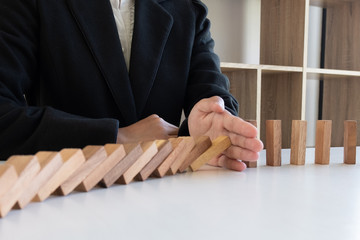 hand stop blocks wood game, gambling placing wooden block. Concept Risk of management and strategy plan, protect business to success