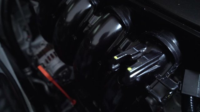 Closeup detailed view of new car engine compartment, Dolly shot