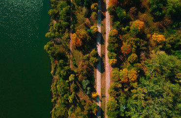 Aerial drone photo. Fall or autumn park landscape with lake. View from above.