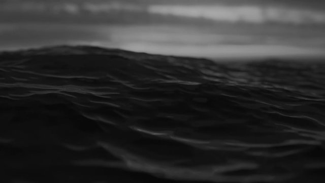 Sea or ocean wave close up, low angle view, slow motion shot. Black and white exotic background
