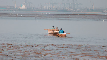 men with boat on the river