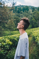 Tourist among many tea plantations in Nuwara Eliya, Sri Lanka