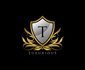 Letter T shield logo with gold color, vintage logo.