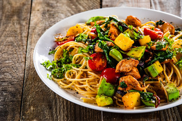 Spaghetti with chicken meat, avocado,mango and cherry tomatoes