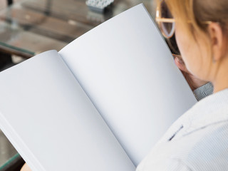 Close-up woman reading a mock-up magazine