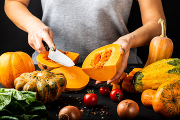 Woman hands prepare pumpkin. Vegetarian healthy diet food concept.