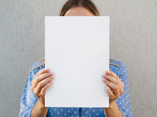 Woman holding a mock-up magazine