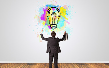 Businessman looking to a wall with new idea concept