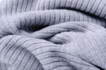 Fototapeta na wymiar Gray sweater fabric textile material texture macro blur background