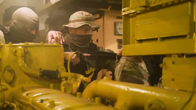 Special forces in search of terrorists. Engine room of the vessel.