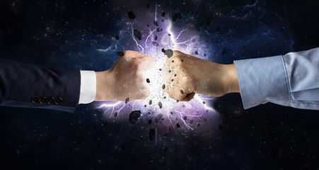 Fototapeta na wymiar Two hands fighting with storm explosion concept