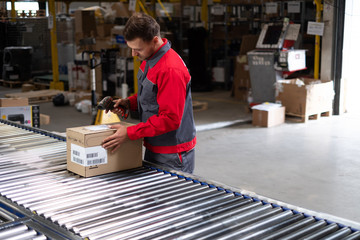 Warehouse worker working on a conveyor line