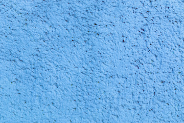 Closeup abstract background of blue concrete stucko wall with pore surface decoration of building facades.