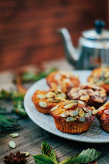 Healthy fall vegetarian dessert. Apple cupcake with pumpkin, almond seeds and spices.