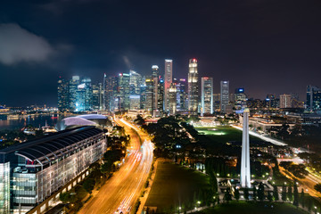 Fototapeta na wymiar Panorama of Singapore business district skyline and skyscraper with War Memorial Park in night at Marina Bay, Singapore. Asia