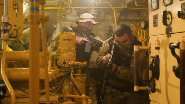 Special forces in search of terrorists. Engine room of the vessel.