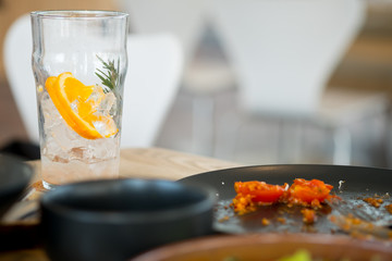 Dirty dishes and dirty glass on a table in a restaurant.