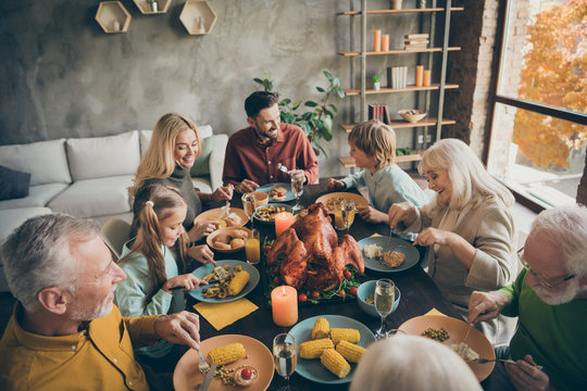 Above high angle view portrait of nice cheerful big full family couples brother sister eating enjoying season domestic meal cuisine dishes gratefulness in modern loft industrial style interior house