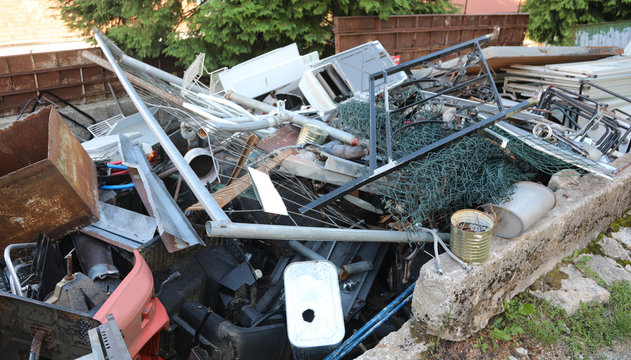 Junk Dealer With Many Old Pieces Of Iron