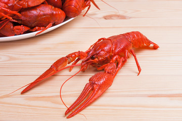 boiled crayfish, on wooden background