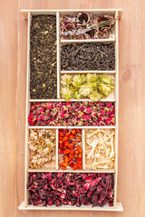 Assorted tea leaves, dried berries and flowers. Healthy drink concept.