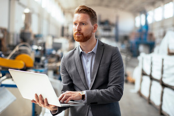 Manager checks machines at the factory. Inspector checks a factory.