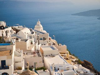 Picturesque view of white town above blue water