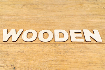 Word wooden on an old table