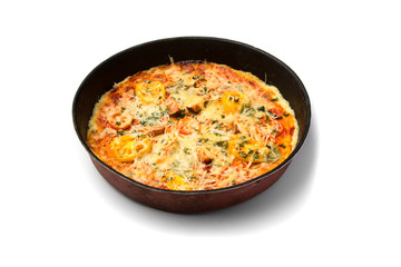 Pizza cooked at home. Baked in an iron pan. Isolated on a white background.