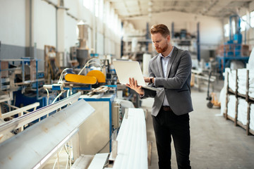 Manager checks machines at the factory. Inspector checks a factory.
