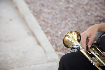 Man playing saxophone outdoors