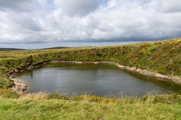 Crazywell Pool created by tin miner excavations near Princetown, Dartmoor, Devon
