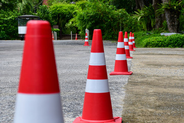 Orange traffic cone are placed to protect the dangers of driving or land traffic to ensure safety.