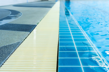 Swimming edge and plastic walkway  That has a line of sight