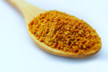 Brown sugar in wooden spoon