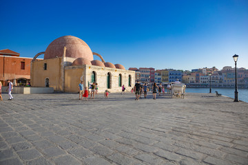 Chania, Crete - 09 July, 2019: View of the historic mosque in the old port of Chania, Crete,...