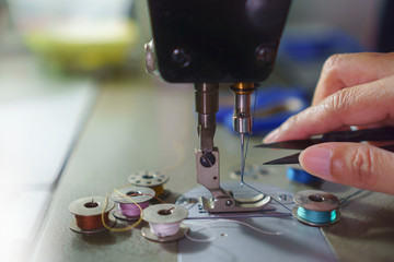 holding scissors sewing machine